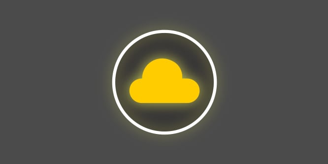 A yellow and white icon with a yellow cloud in the middle of a circle on a dark grey background depicting premium soft fabric.
