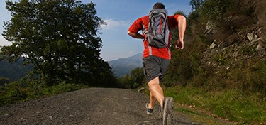 man running on mountain path
