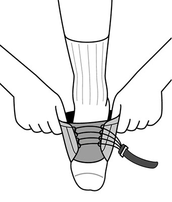 Unfasten right strap and loosening lacing, then slipping foot into ankle support.
