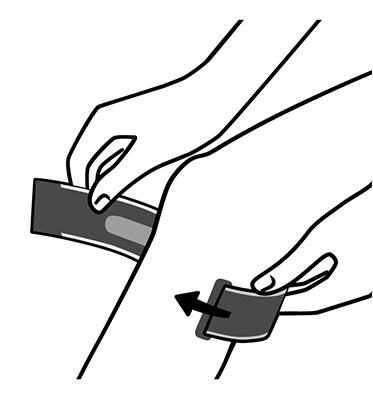 Wrapping knee strap below knee, placing Pressure Pad under kneecap.