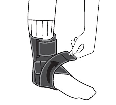 Attaching the right strap, as well, then adjusting the ankle support for comfort.