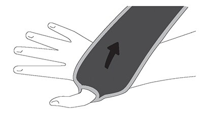 Placing thumb in loop of wrist support and wrapping over top.