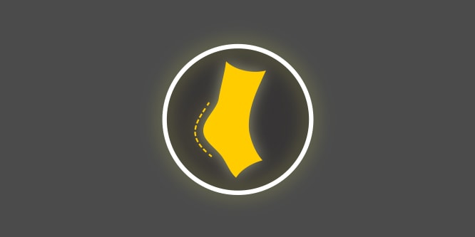 A yellow and white icon with a heel of a foot within a circle, on a dark grey background depicting reduced chafing and rubbing.
