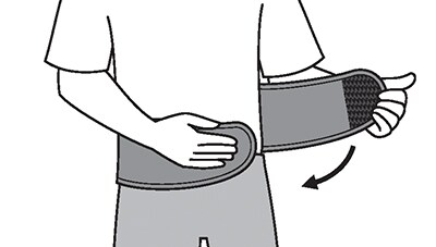 Wrapping panels of the back support brace around the waist.