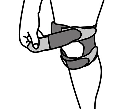 Sliding top strap of knee support band through opening, applying gel pad, and applying tension.