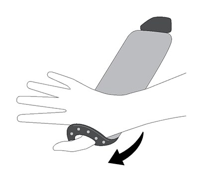 Inserting thumb to wrist support brace and wrapping around wrist.