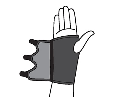 Sliding hand into wrist support brace.