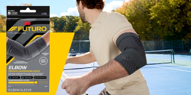 FUTURO Premium Elbow Compression Sleeve on a person playing tennis.
