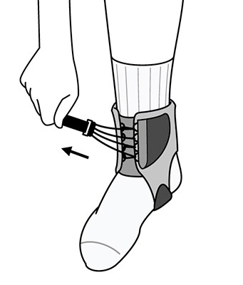 Pulling small strap around side of ankle to tighten.